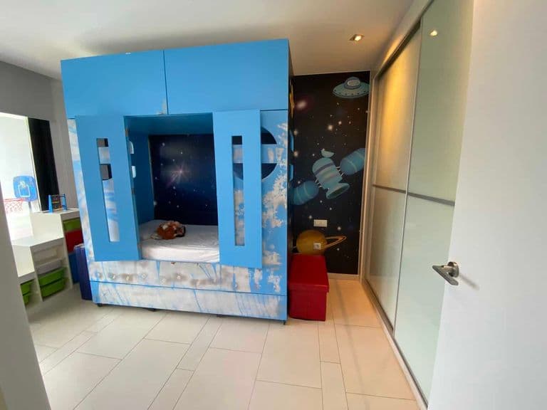 Children's play area with blue module and space murals