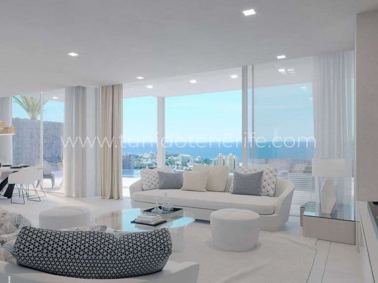 Bright living room with large windows and white sofa