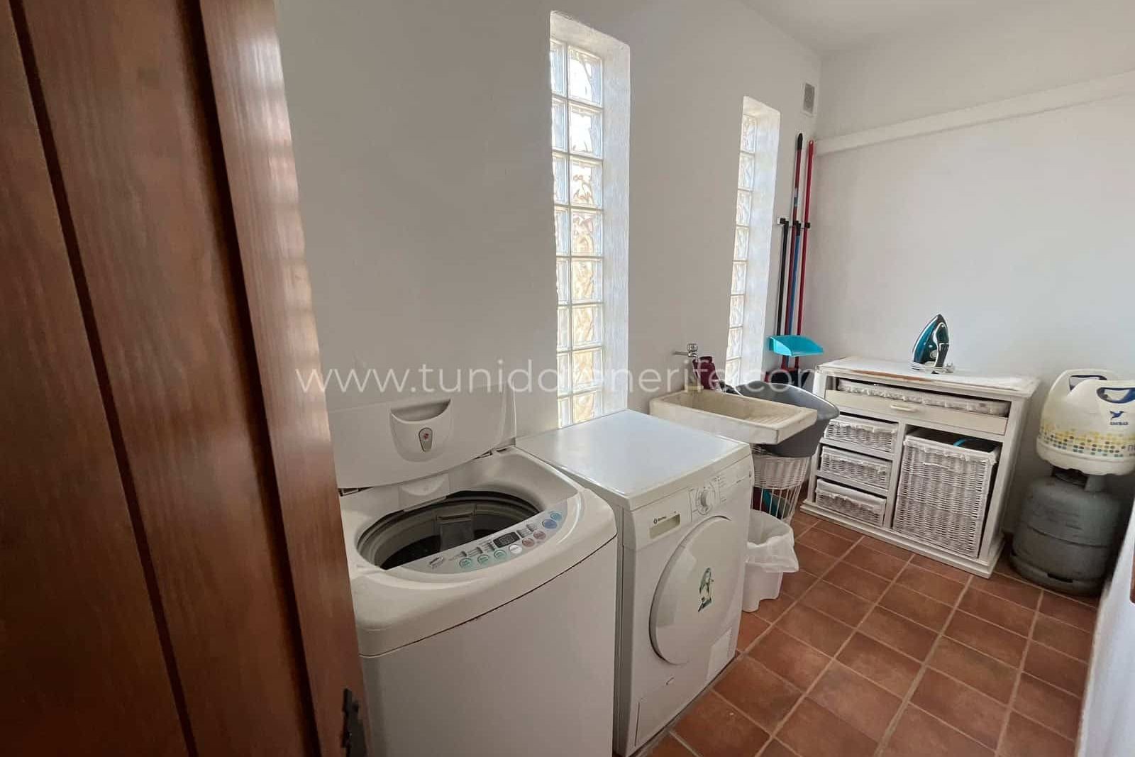 Laundry room with washing machine, dryer and sink
