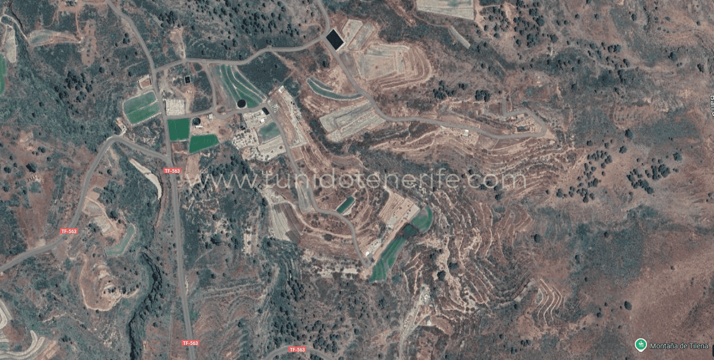 Aerial view of plots, roads and arid terrain