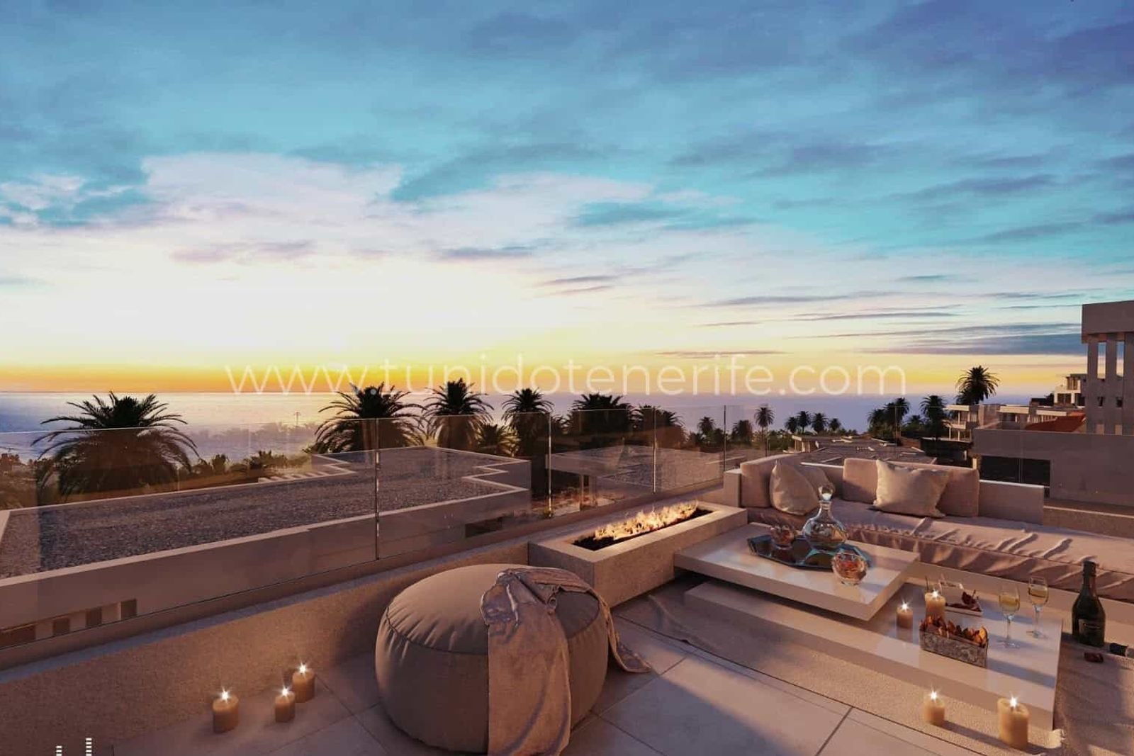 Terrace with modular sofa, coffee table and candles at sunset