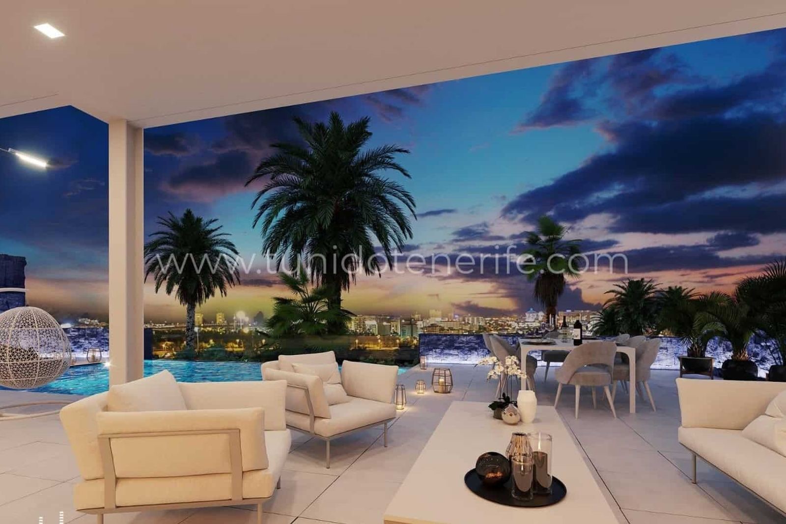 Terrace with white sofas, table and sunset views