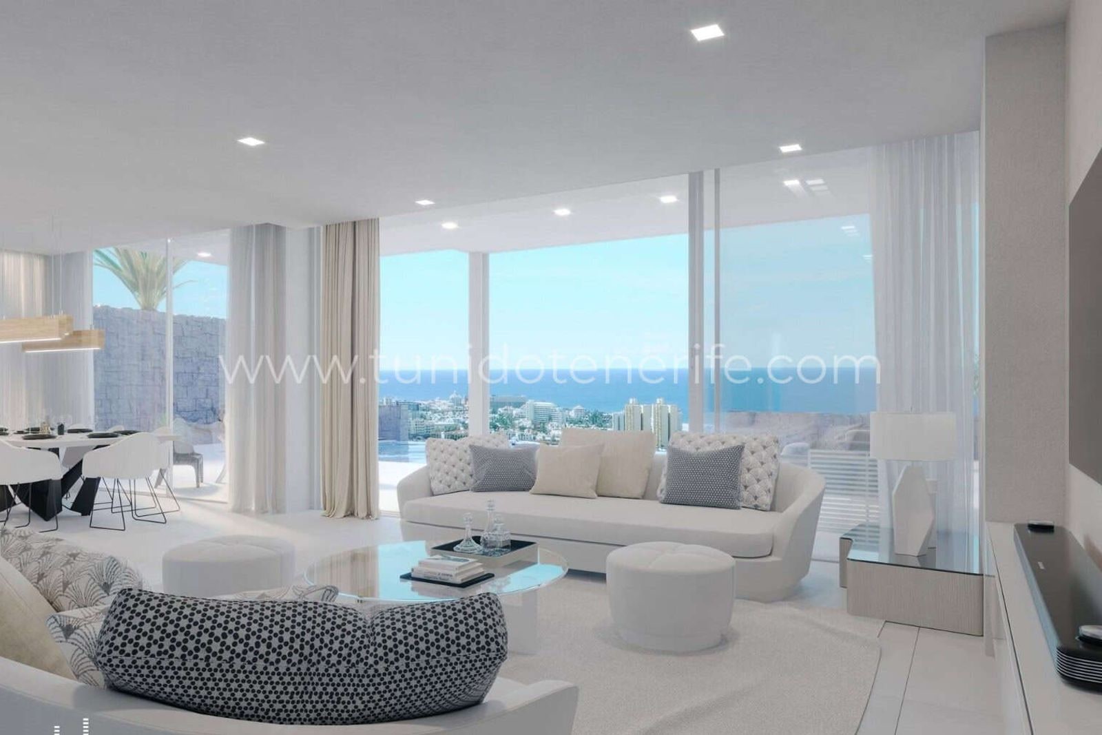 Bright living room with large windows and white sofa