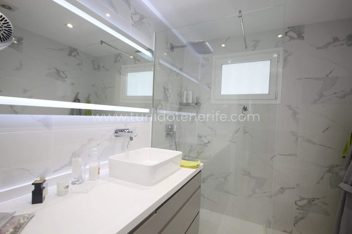 Modern bathroom with shower and countertop sink