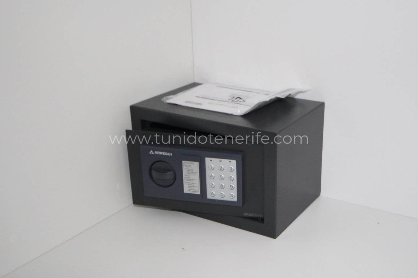 Black safe on white surface