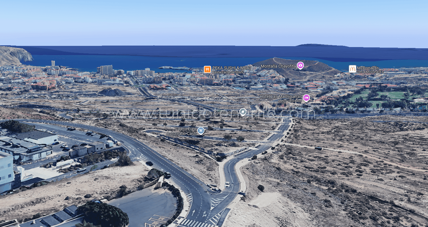 Aerial view of roads, roundabout and arid coastal landscape