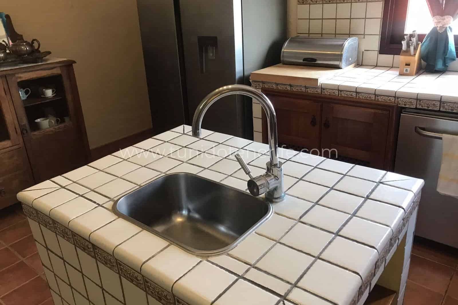 Kitchen with central island and stainless steel sink