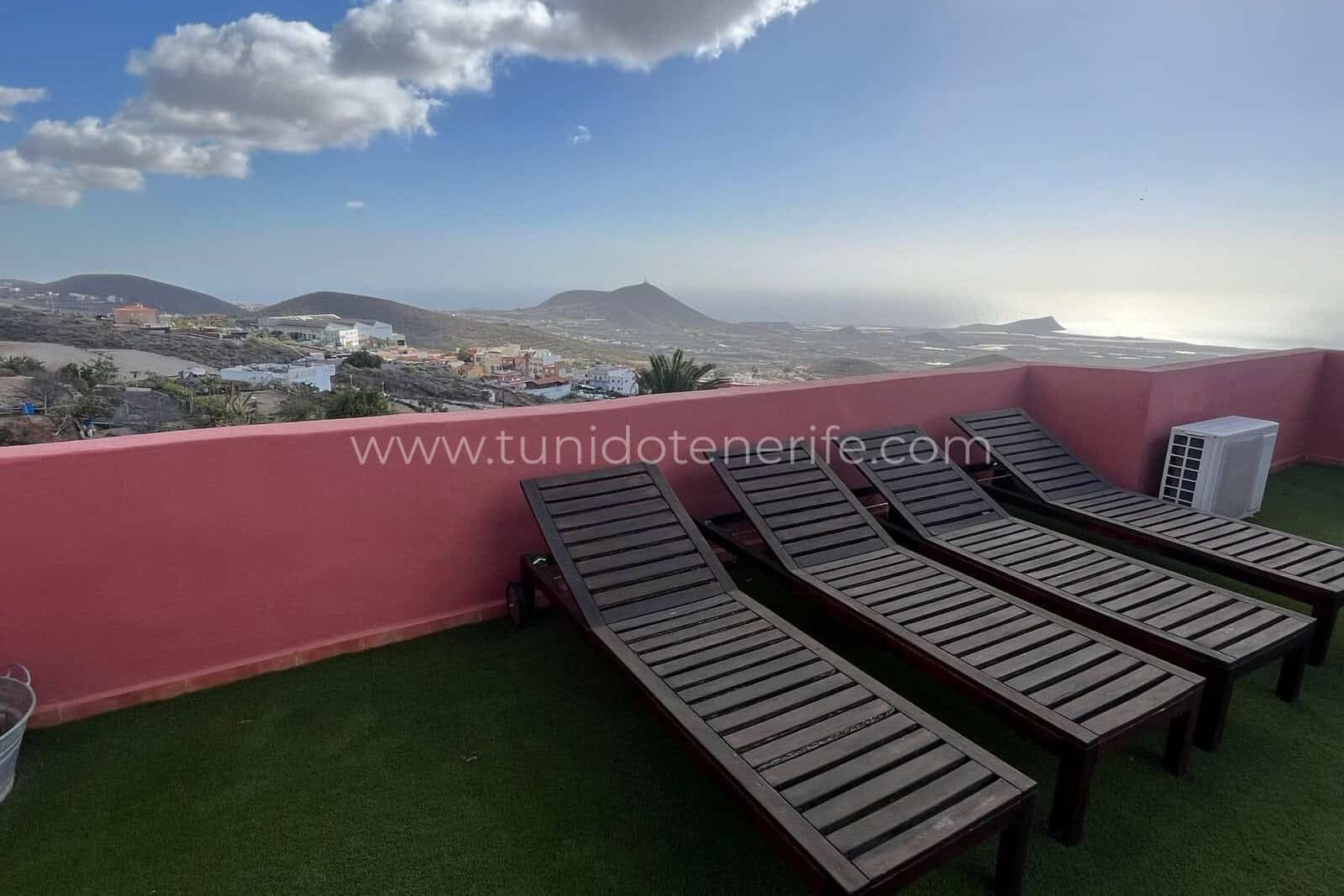 Terrace with loungers and landscape views